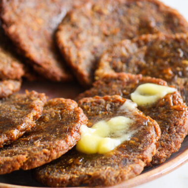 Traditional Maharashtrian sweet made from pumpkin and jaggery dough, deep-fried like puris