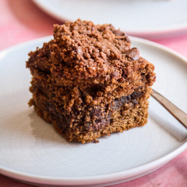 Soft chocolate cake with a cocoa sugar filling, chocolate crumb topping and chocolate chips in every layer!