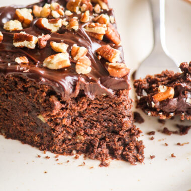 A rich and fudgy cake with dark chocolate, ground pecans and a dark chocolate ganache