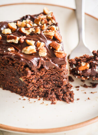 A rich and fudgy cake with dark chocolate, ground pecans and a dark chocolate ganache