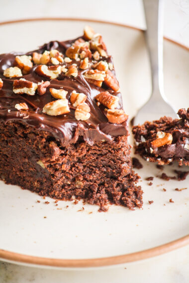 A rich and fudgy cake with dark chocolate, ground pecans and a dark chocolate ganache