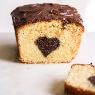 A buttery, mini loaf cake with vanilla cake on the outside and a surprise chocolate heart on the inside!