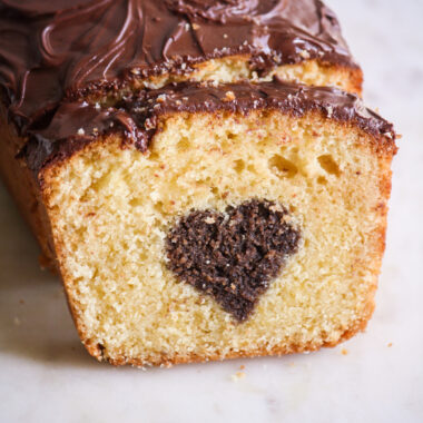 A buttery, mini loaf cake with vanilla cake on the outside and a surprise chocolate heart on the inside!