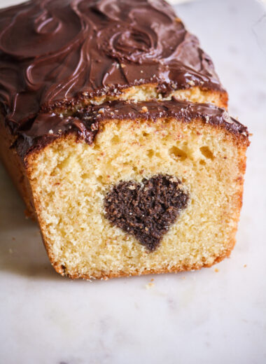 A buttery, mini loaf cake with vanilla cake on the outside and a surprise chocolate heart on the inside!