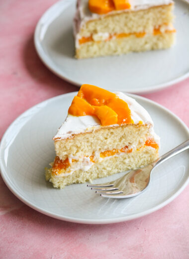 Soft desiccated coconut sponge cake filled with whipped cream and fresh mango