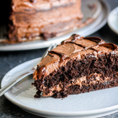 Soft, eggless dark chocolate cake with chocolate chips and a whipped chocolate ganache frosting