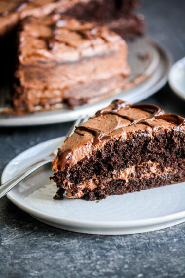 Soft, eggless dark chocolate cake with chocolate chips and a whipped chocolate ganache frosting