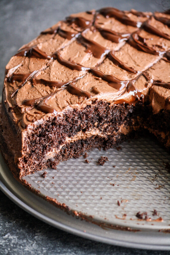 Soft, eggless dark chocolate cake with chocolate chips and a whipped chocolate ganache frosting