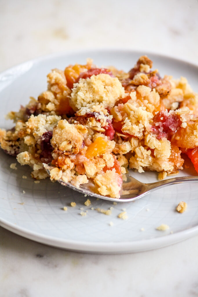Fresh peaches and cherries baked with an oat crumble topping