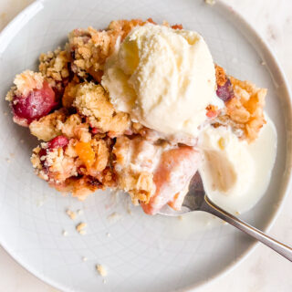 Fresh peaches and cherries baked with an oat crumble topping