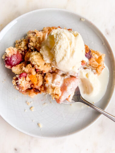 Fresh peaches and cherries baked with an oat crumble topping