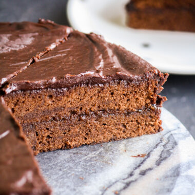 Soft chocolate sponge filled and covered with apricot jam plus a crackly chocolate glaze