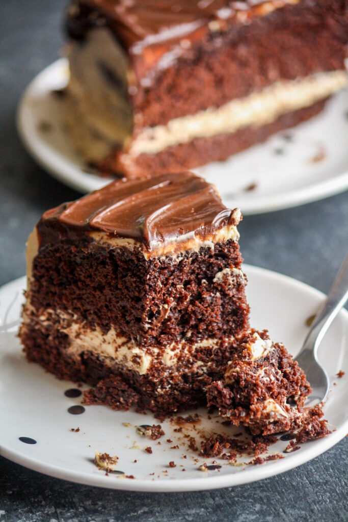 Rich chocolate cake layered and topped with creamy peanut butter frosting and a chocolate ganache to finish