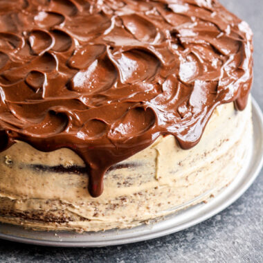 Rich chocolate cake layered and topped with creamy peanut butter frosting and a chocolate ganache to finish