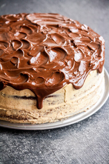 Rich chocolate cake layered and topped with creamy peanut butter frosting and a chocolate ganache to finish