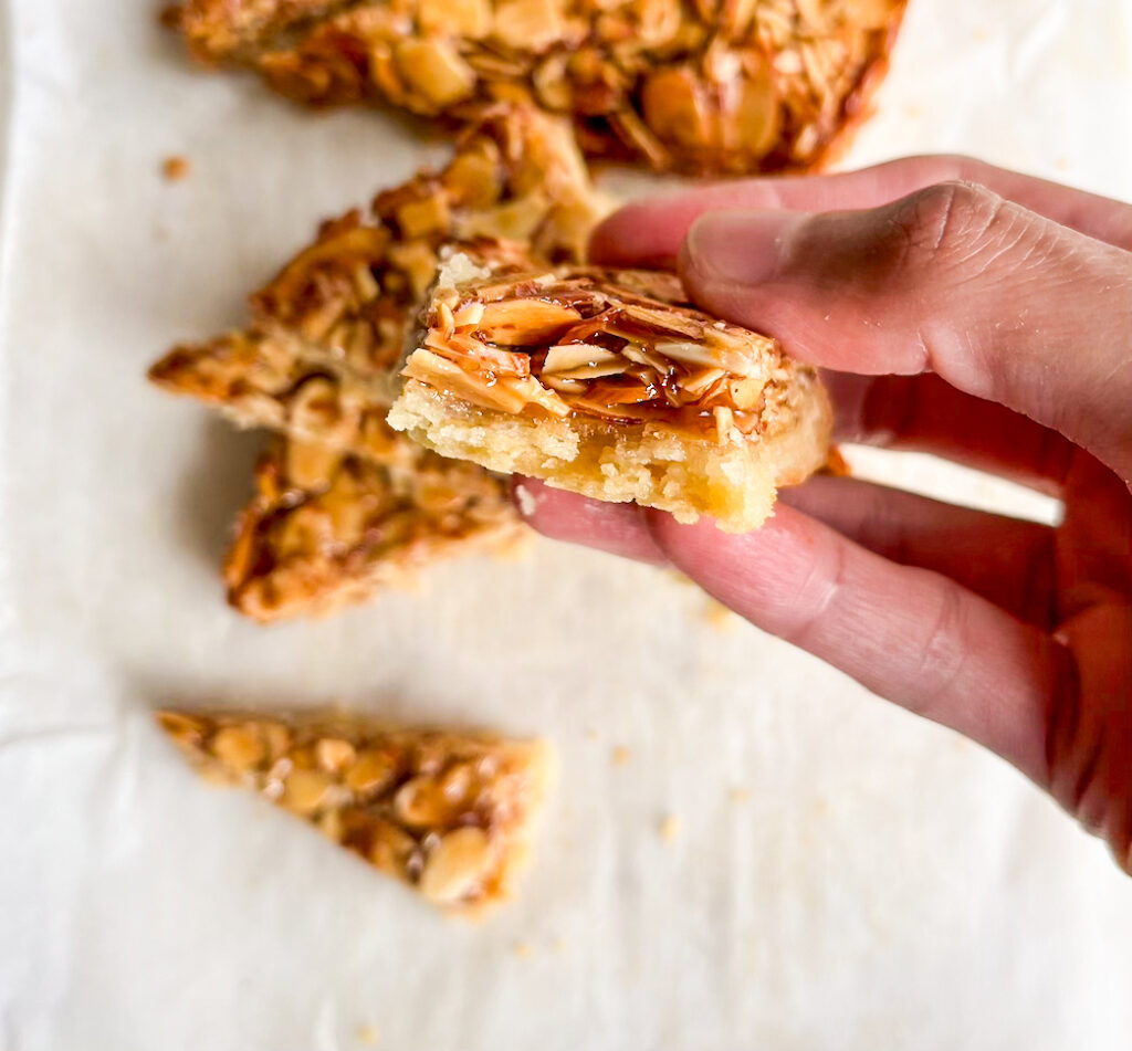 Crisp buttery shortbread crust with a topping of crunchy almonds coated in honey caramel