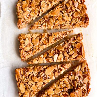 Crisp buttery shortbread crust with a topping of crunchy almonds coated in honey caramel