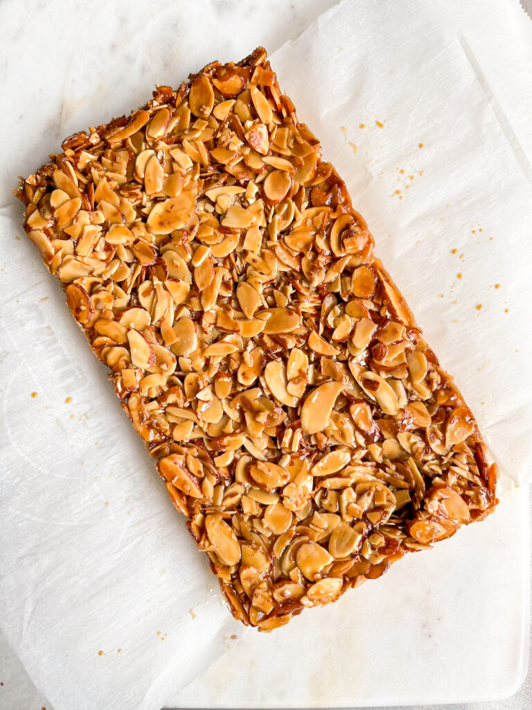 Crisp buttery shortbread crust with a topping of crunchy almonds coated in honey caramel