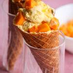 Easy, delicious, mango icecream with cream cheese and biscuit pieces!