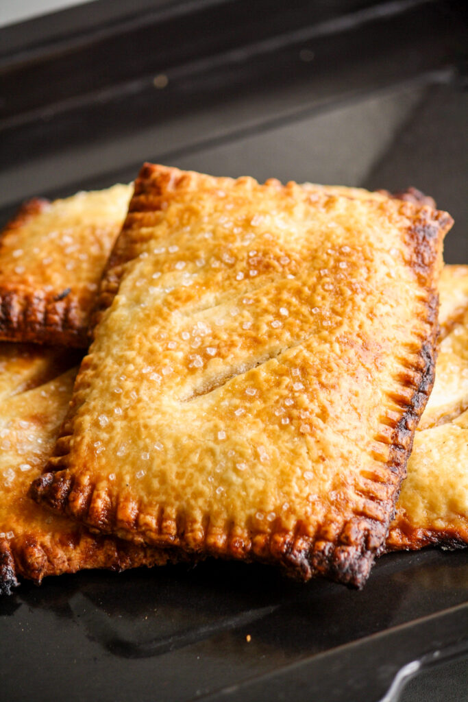 Buttery, flaky individual pies filled with jammy, cinnamon-scented peaches