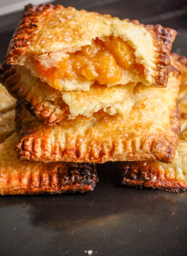 Buttery, flaky individual pies filled with jammy, cinnamon-scented peaches