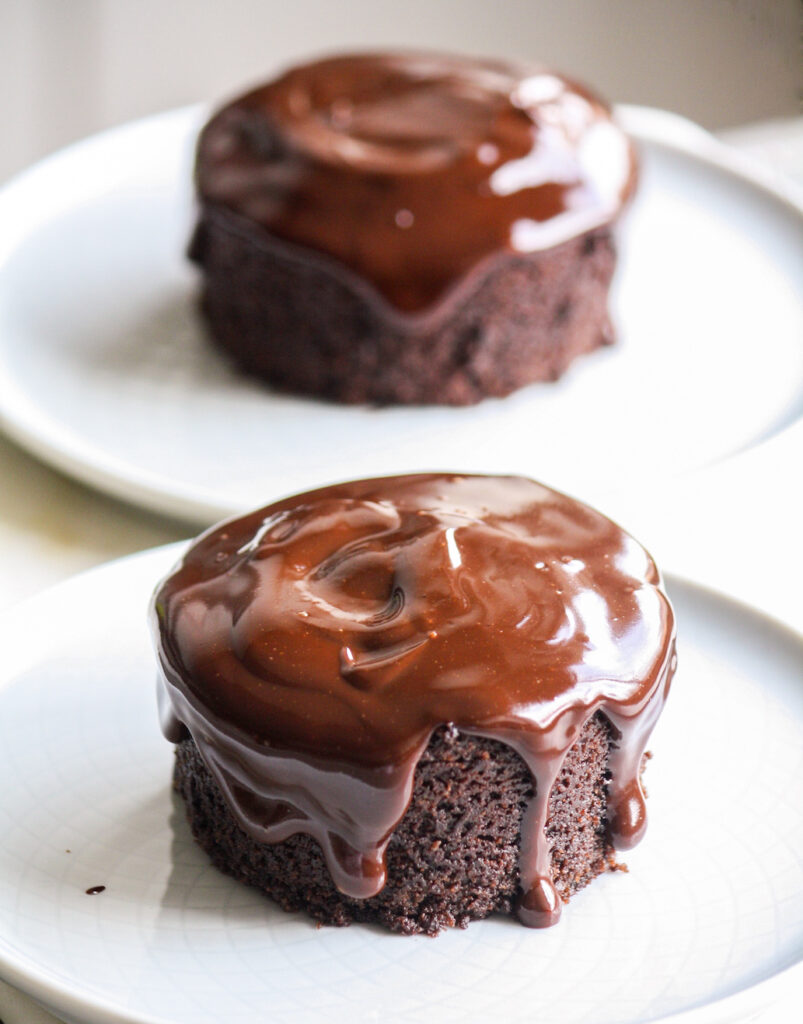 Two individual chocolate cakes with a simple ganache and no eggs