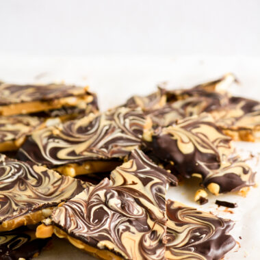 Crunchy toffee base with salted peanuts, dark chocolate topping and peanut butter swirled on to
