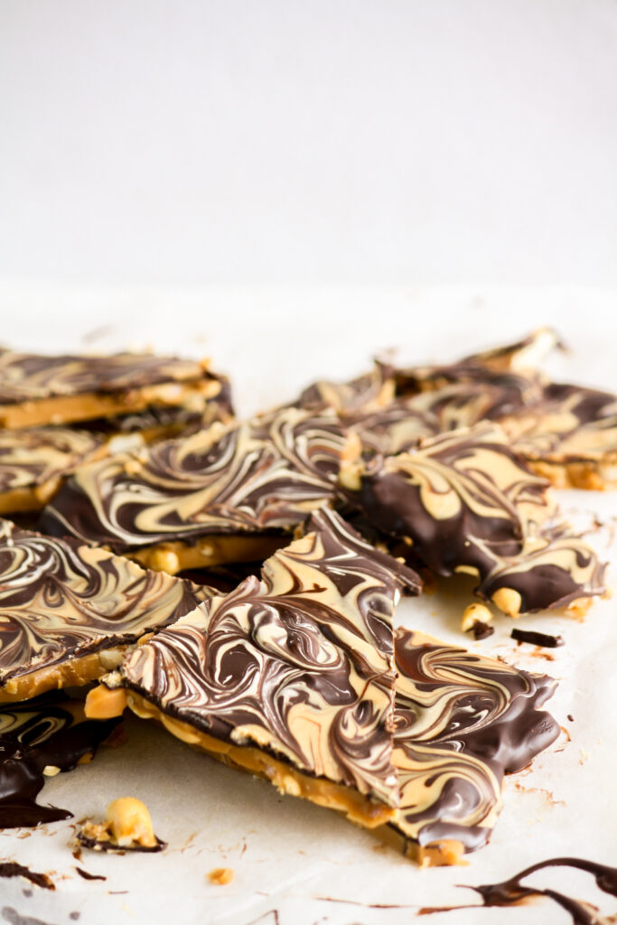 Crunchy toffee base with salted peanuts, dark chocolate topping and peanut butter swirled on top