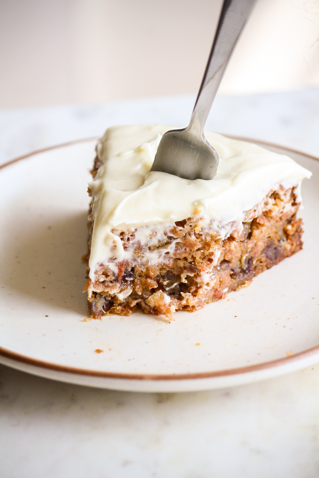 Moist carrot cake with chopped dates and an easy cream cheese frosting