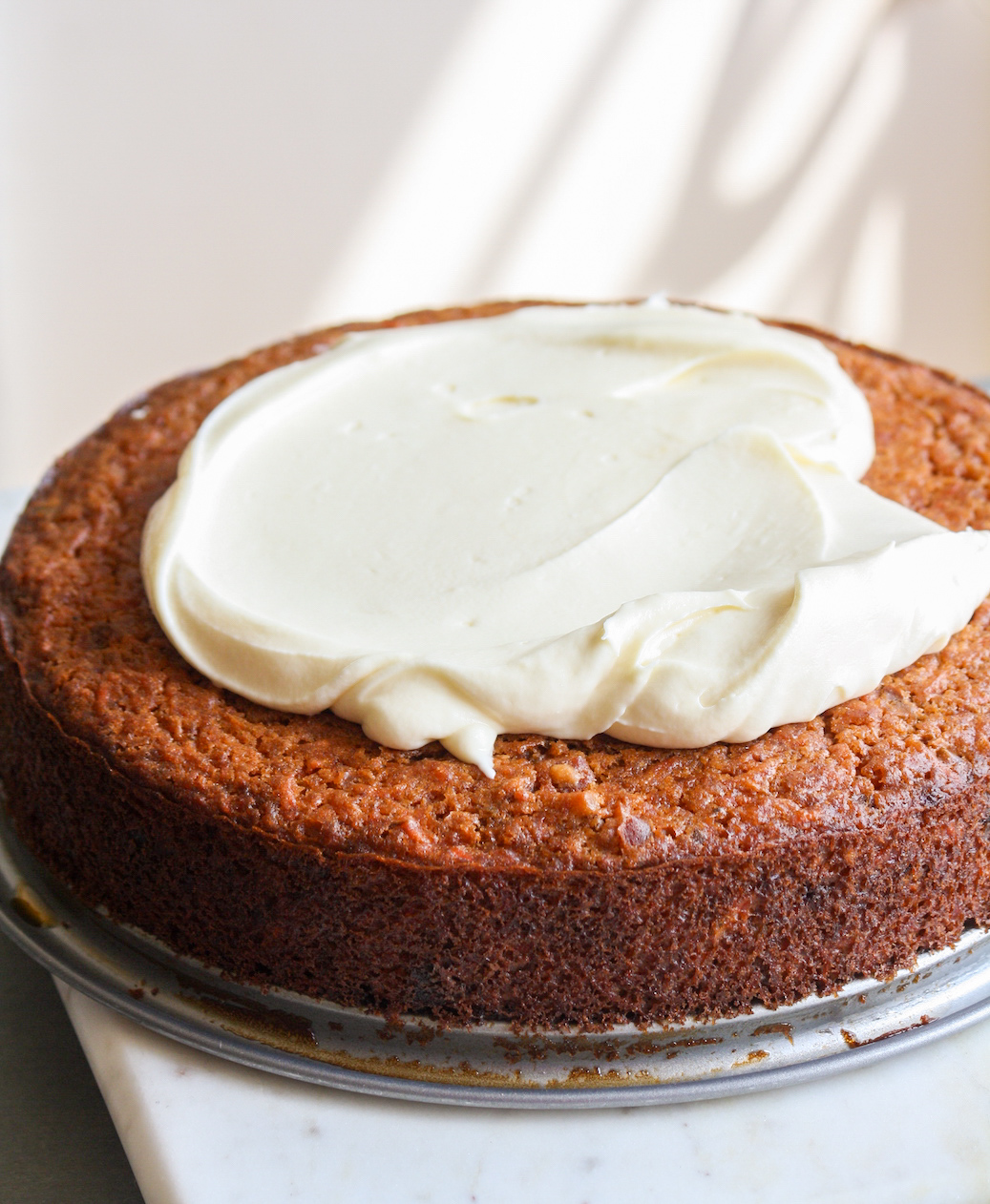 Moist carrot cake with chopped dates and an easy cream cheese frosting